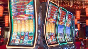 Live dealer at Dream Gaming table with multi-camera display showing cards and betting interface